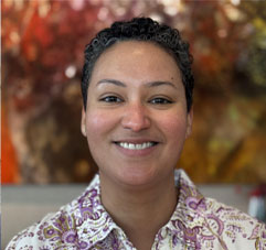 Christina Claudio ’04. Link to her story