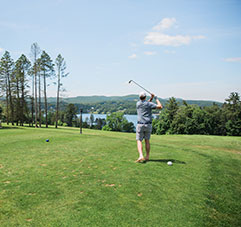 A man playing golf. Link to Gifts of Appreciated Securities