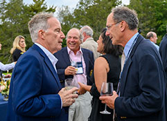 Photo of two men talking. 