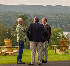 Three men talking outside. Link to Gifts from Retirement Plans