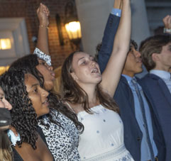 Students cheering. Link to What to Give